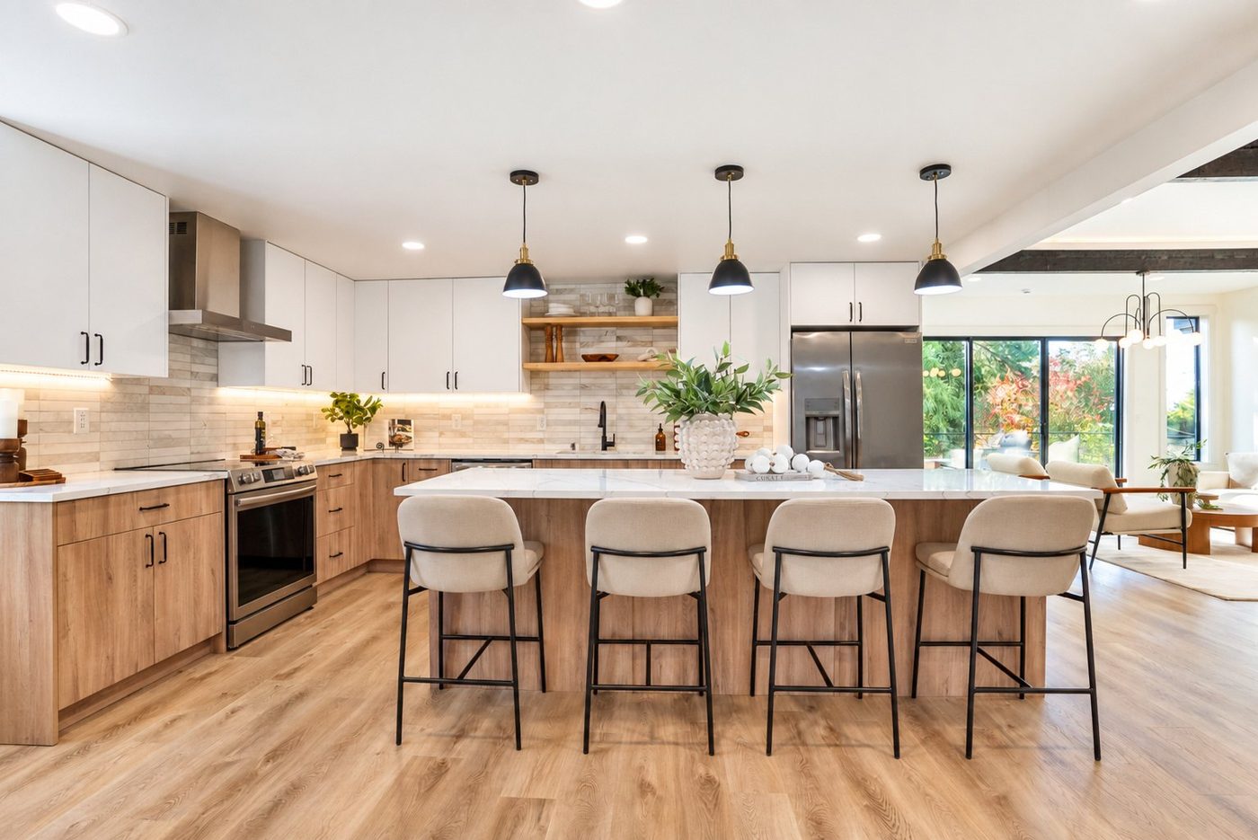 Kitchen with a long island, wood cabinets and three pendants