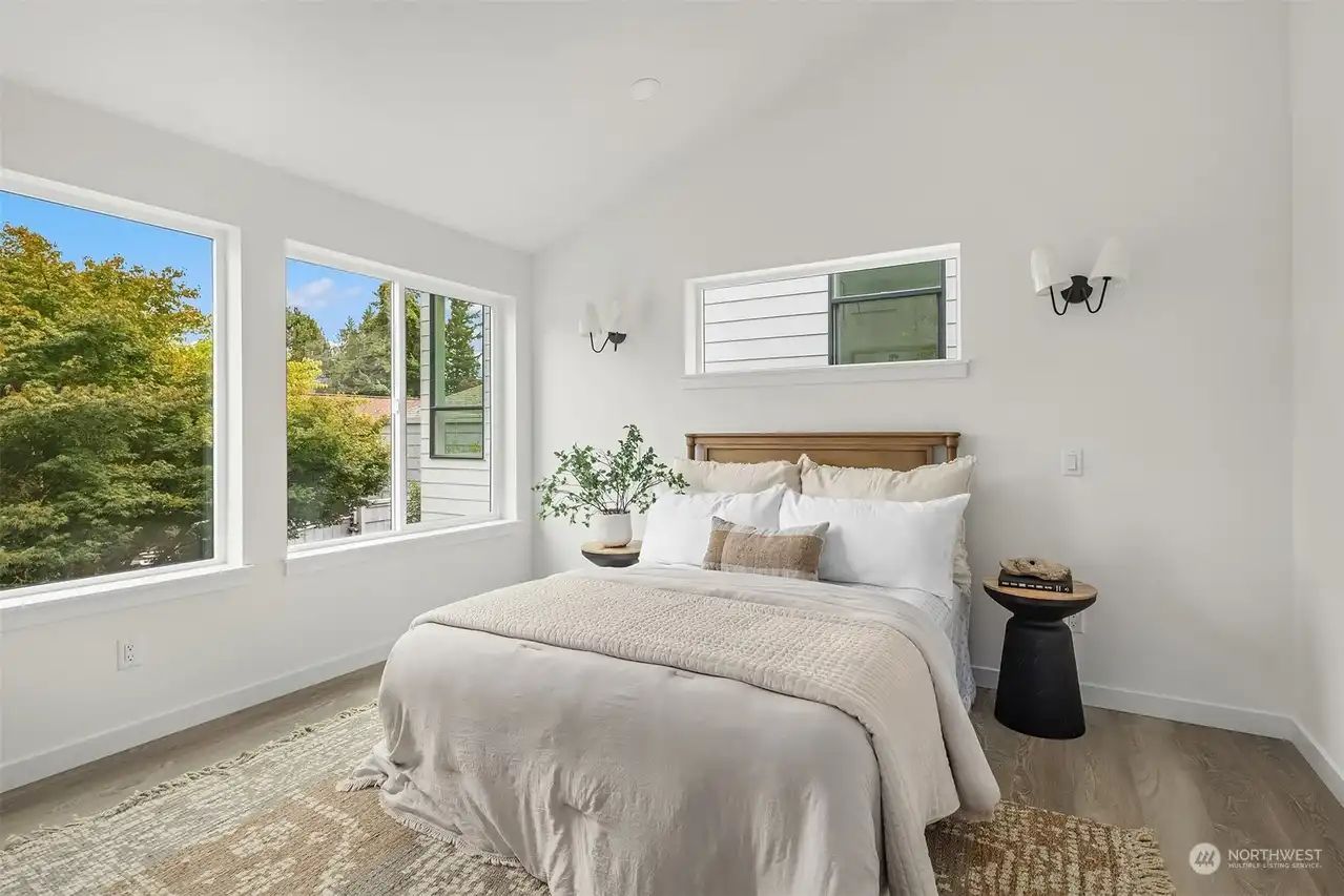 Bedroom with a vaulted ceiling and a mini-split