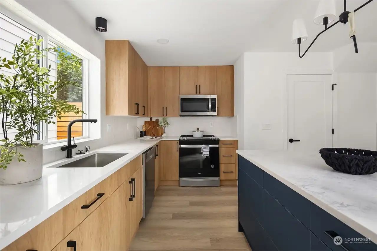 Kitchen counter and sink under a window