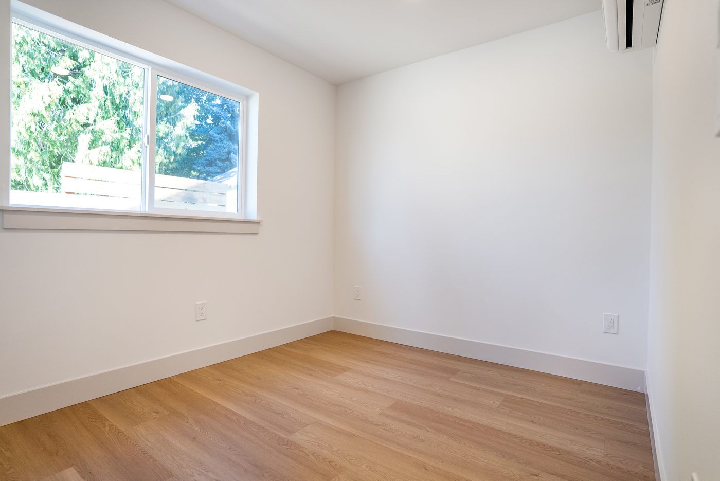Bedroom with a window and a mini-split