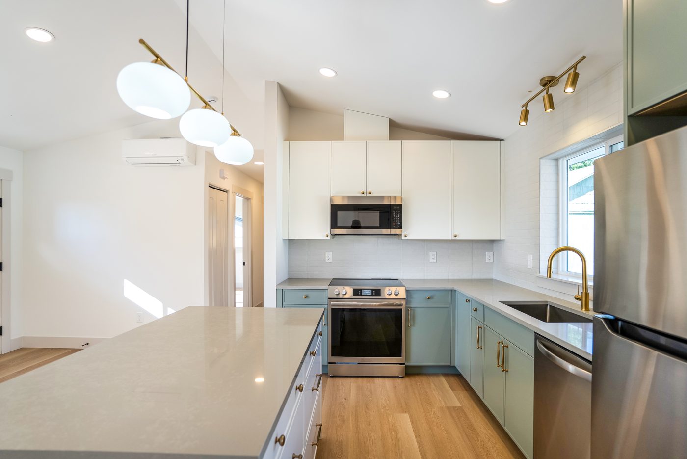 Kitchen counter with a stainless range and brass faucet